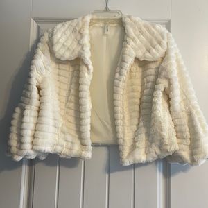 Tacera. Cream faux fur short cover/jacket. Size M.